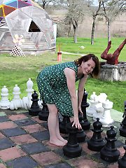 Cute mature lady playing with her pink pussy