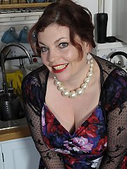 Chubby mom takes off provocative lingerie and poses