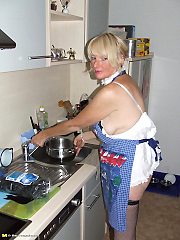 Naughty housewife gets frisky in the kitchen