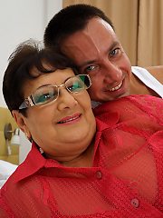 Naughty big mama playing with her toy boy