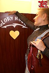 Kinky mature slut sucking through the gloryhole