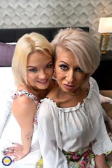 Young couple sharing the bed with a hot MILF