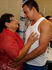 Naughty big mama playing with her toy boy