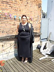 Kinky mature slut naked on a roof