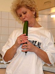 Stuffing vegetables in her cunt