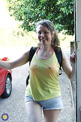 Hairy mature lady playing with the hose in the garden
